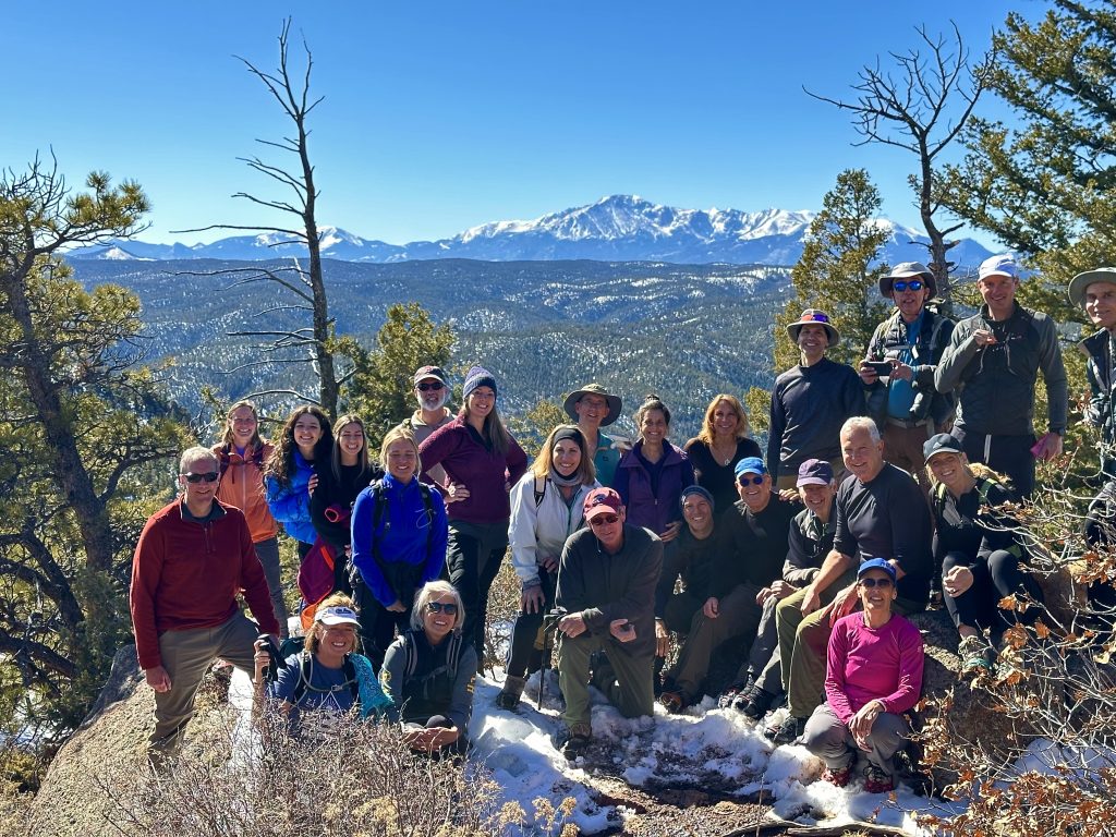 Grpup atop Mt. Herman with Pikes Peak in the background.