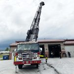 Above: The ladder was operated by Driver Operator/Engineer Tyler Brickell (pictured below the ladder). Vice President John Hildebrandt and Treasurer Tom Kelly also took a trip above the station in the bucket before the board meeting. Photos by Natalie Barszcz.