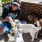 Above: On a beautiful Sunday morning, Palmer Lake business owner Raquel Garcia, who owns both the Lake & Lantern
restaurant and Hard Beauty hosted an event called Goat Mornin’ Sunshine. Partnering with Whispering Willow Ranch,
which brought a herd of baby goats along with papa goat Rhett, they off ered baby goat cuddles, community connection,
and a special brunch. Attendees came from the surrounding community in Tri-Lakes and Colorado Springs. Hard
Beauty and Hard Beauty Foundation support off ers trauma-informed, healing center recovery programs. Lake & Lantern
restaurant strives to create an alcohol-free sanctuary for connection hosting karaoke, open mic, recovery meetings and
other events. Whispering Willow Farmstead LLC, run by Paula and Butch Hoshaw, off ers recovery sessions, opportunities
for scout patches, and animal therapy including goats, turkeys, horses, pigs, and more. For more information, see their
page on Facebook. Garcia is pictured feeding and cuddling Elsa, Anna, and Pebbles. Photo by Jackie Burhans.