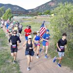 Above: right: Runners make their way around Palmer Lake just after the start of the Palmer Lake Fun Run. Photos by David Futey.