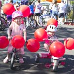 Above: Gloria Beasley and Joy Beasley used balloons for a festive bike decoration as they readied to join in the Monument Hill Kiwanis Children’s Parade. Photo by David Futey