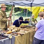 Above: On June 21, the Western Museum of Mining & Industry (WMMI) celebrated its annual History Day. Pictured: WMMI visitors speak with a military re-enactor who provided information on the history of military rifles. The event was filled with a mix of activities and information from the museum and other organizations. Visitors could take hayrides around the property, ride in a soap box derby car provided by the Pikes Peak Soap Box Derby organization, review military equipment, watch a military re-enactment, speak with re-enactors from the Colorado Military Historical Group Inc. and U.S. Army 250, and learn about other museums such as the Black American West Museum & Heritage Center in Denver and McAllister House Museum located in Colorado Springs. The WMMI operated some of its outdoor equipment including the Yellow Jacket Stamp Mill and the Osgood Steam Shovel. Information on upcoming events at the museum is at www.wmmi.org. Photo by David Futey.