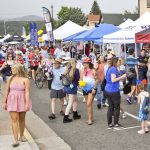 Above: Before and after the parade, people enjoyed the Tri-Lakes Chamber of Commerce Street Fair on the Fourth of July. Local businesses, non-profit organizations, food vendors and a variety of arts and crafts booths were available for browsing. Photo by David Futey.